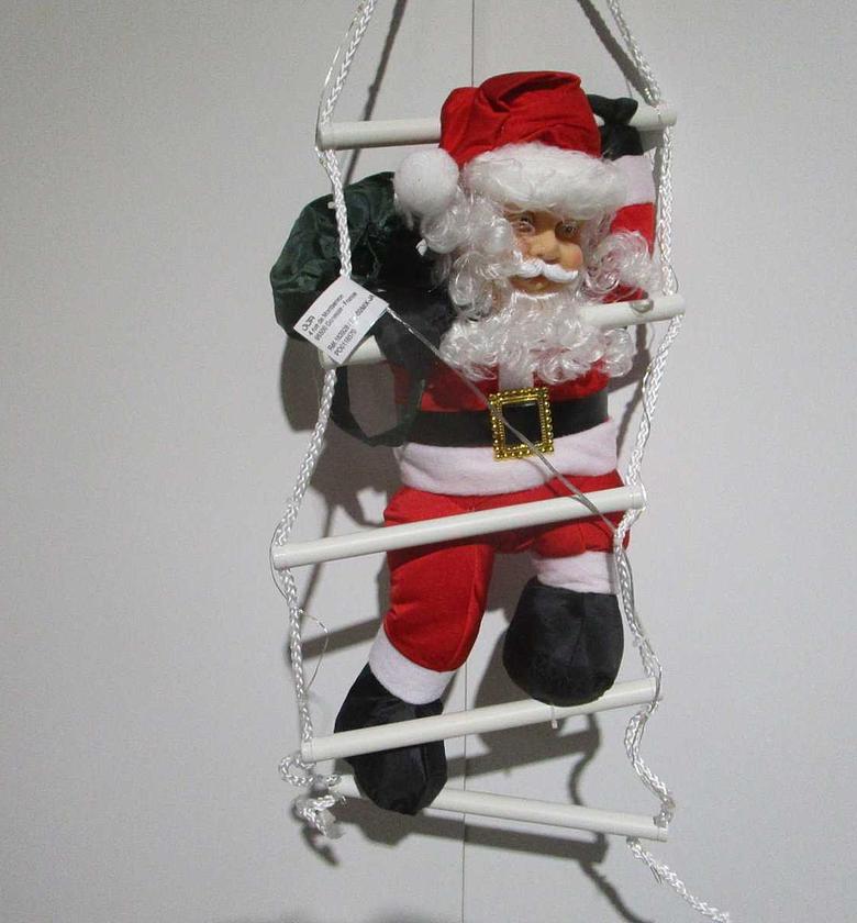 Christmas climbing santa ladd image